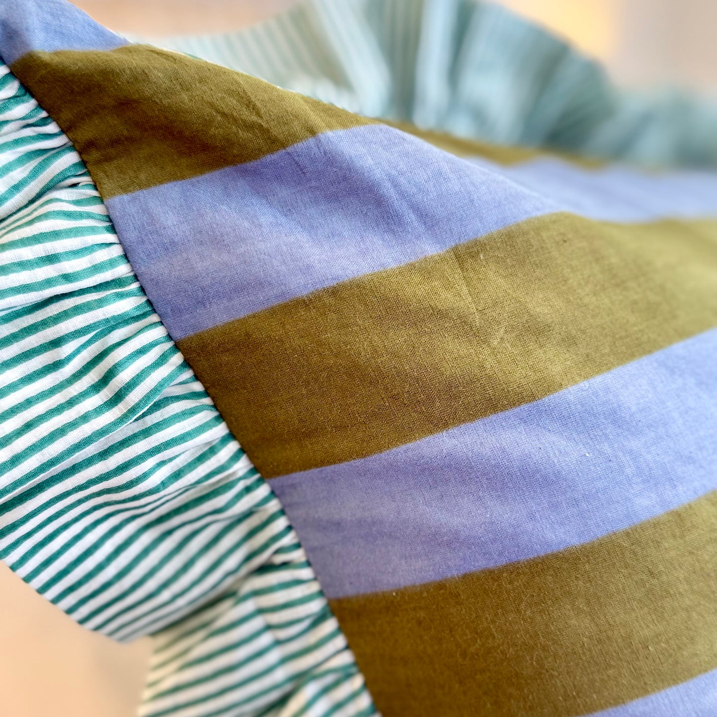 Striped cotton cushion with frill