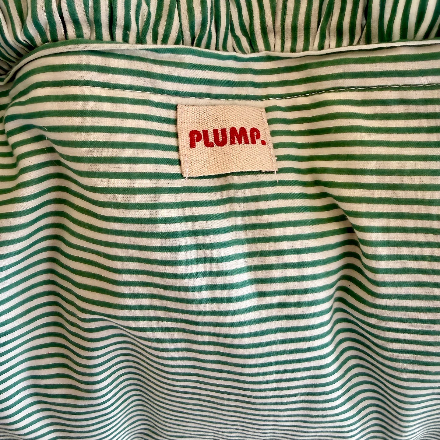 Striped cotton cushion with frill