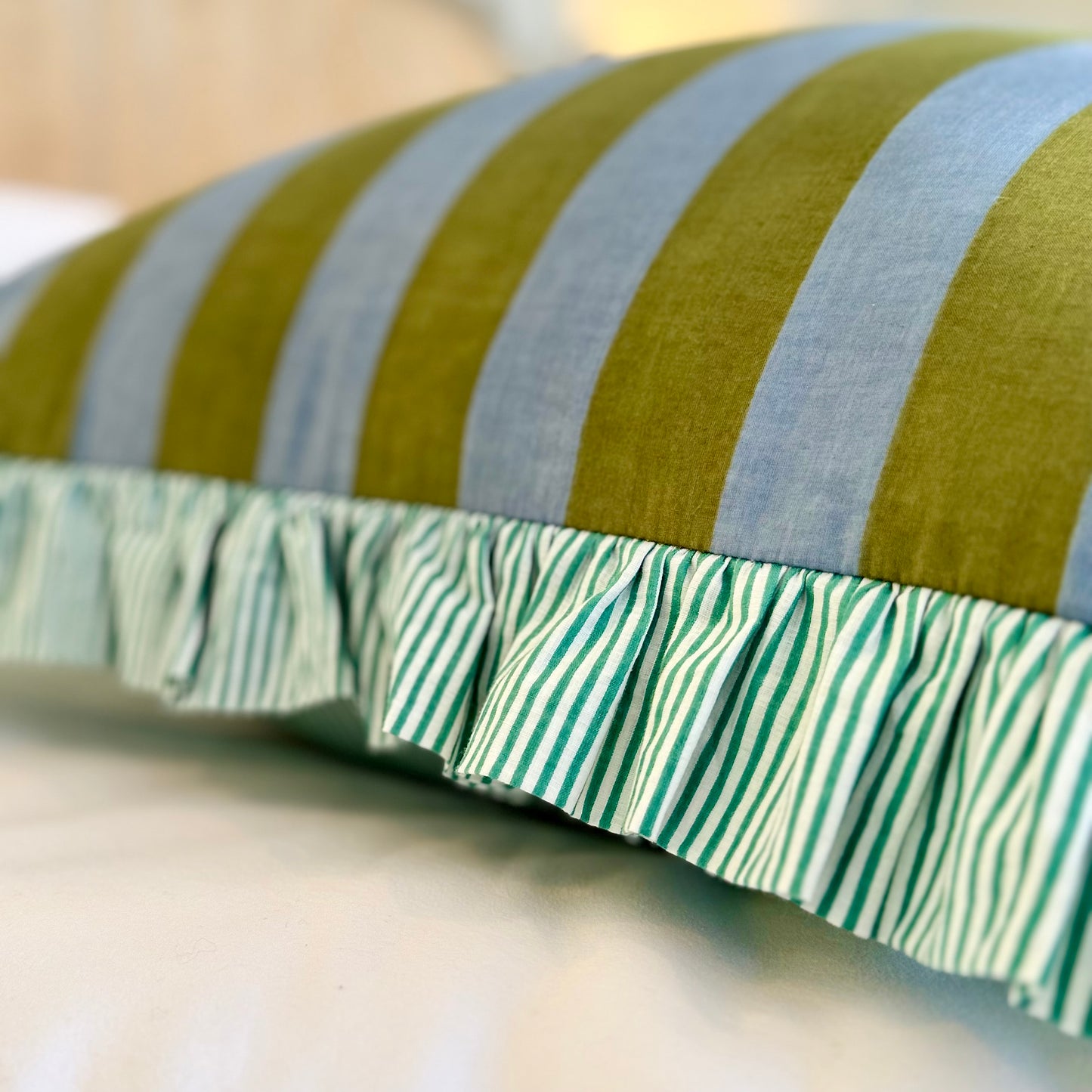 Striped cotton cushion with frill