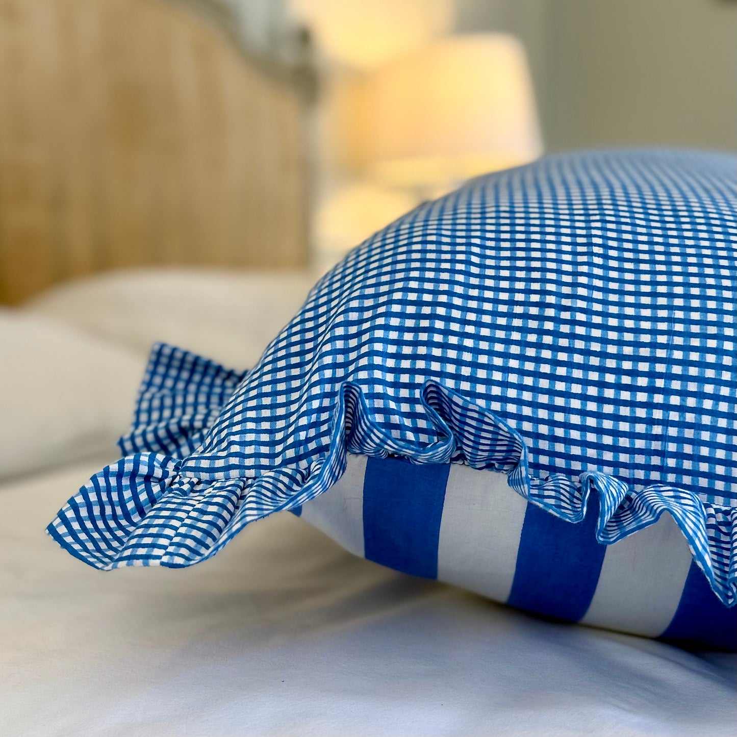 Blue striped cotton cushion with frill
