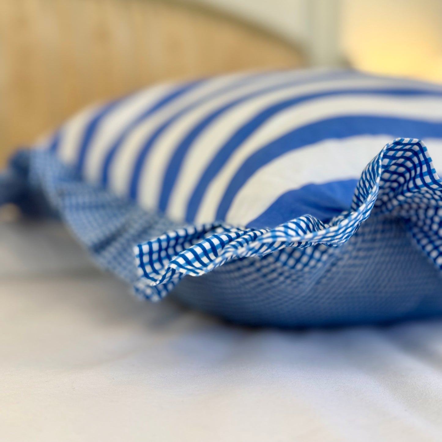 Blue striped cotton cushion with frill