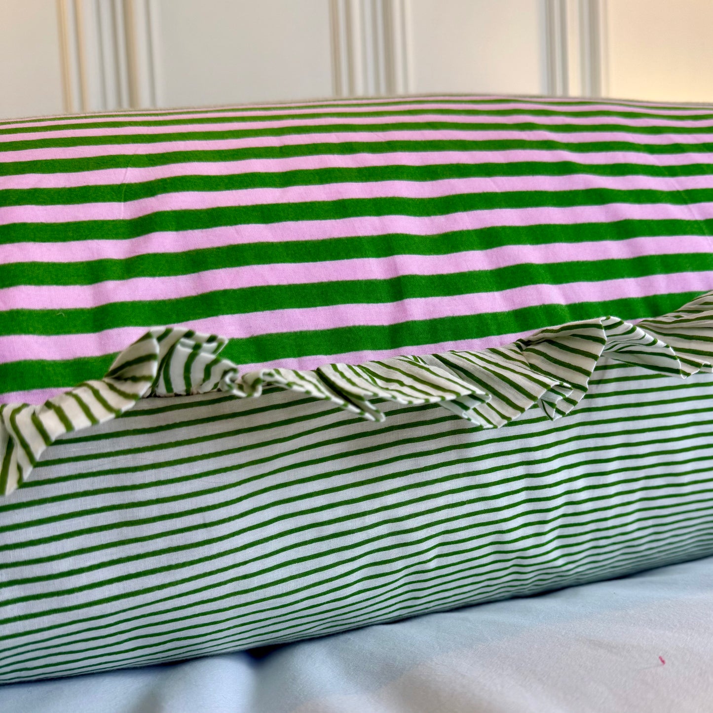 Pink and green striped cotton cushion with frill