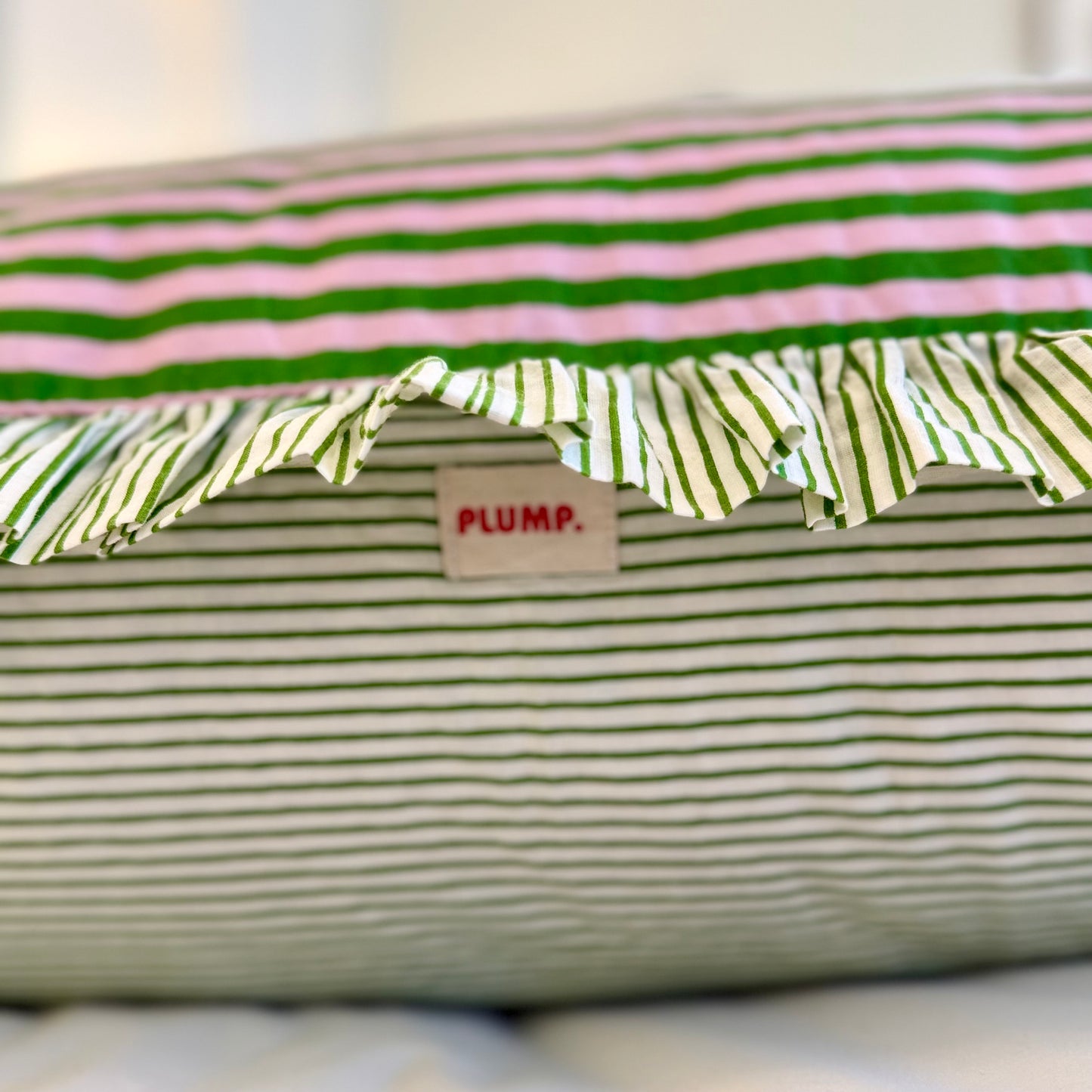 Pink and green striped cotton cushion with frill