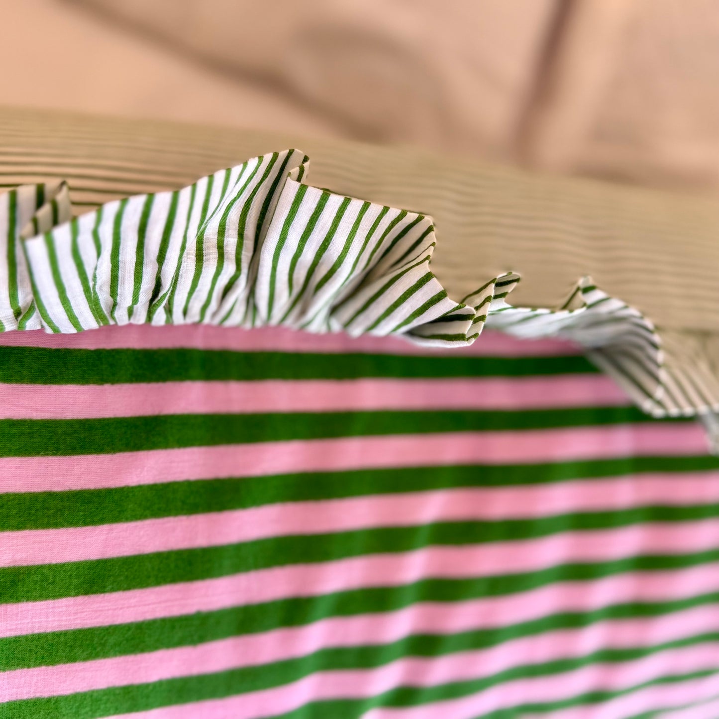 Pink and green striped cotton cushion with frill