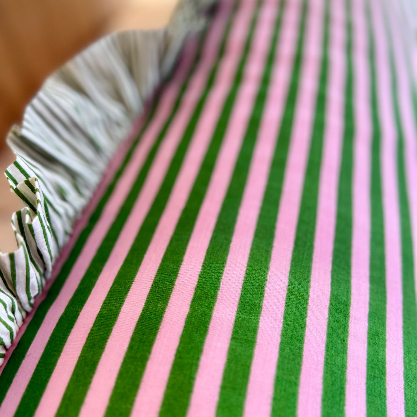 Pink and green striped cotton cushion with frill