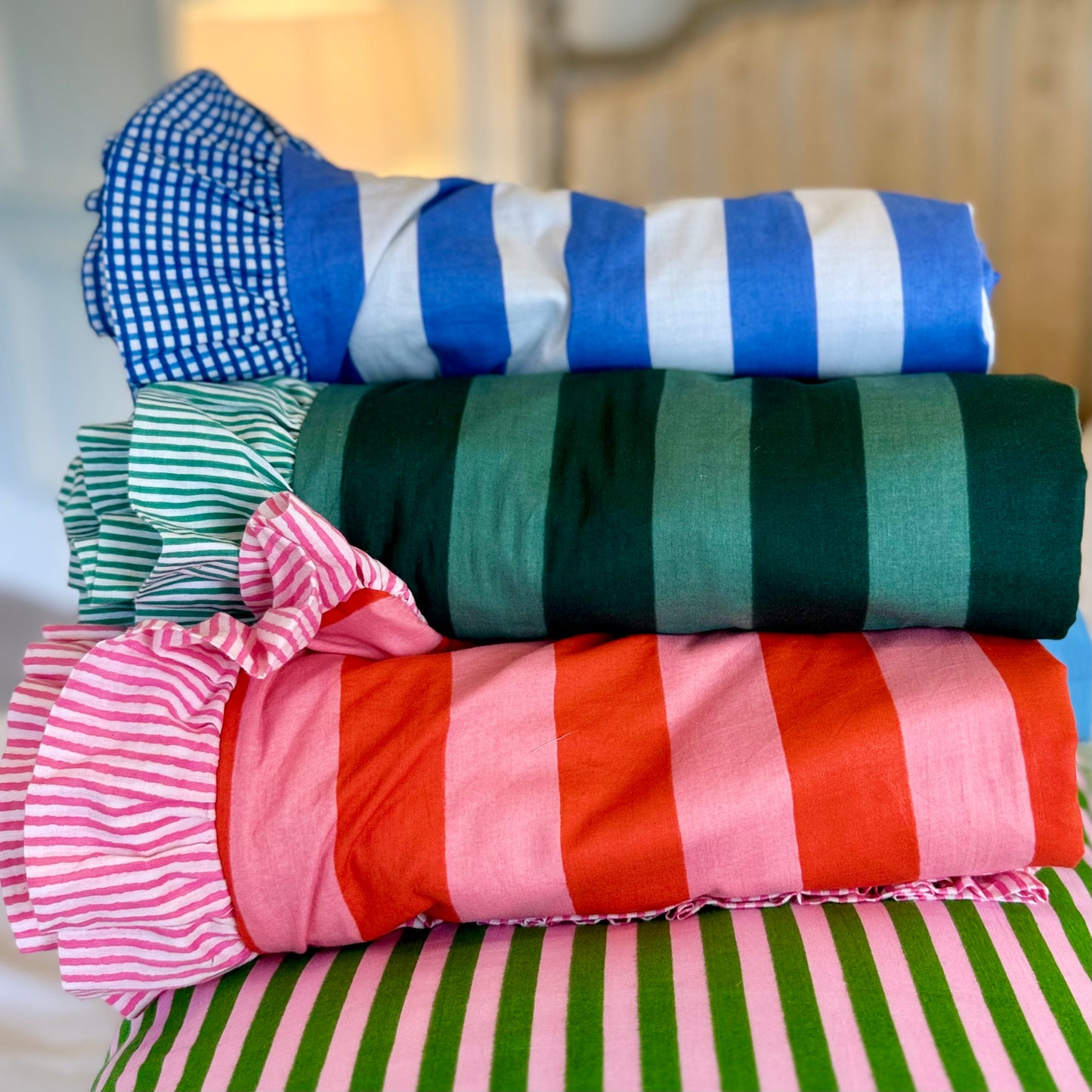 Pink and green striped cotton cushion with frill